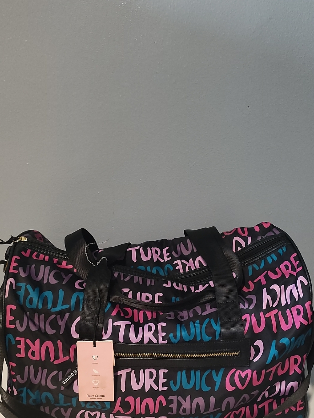 The item shown is a Juicy Couture "Multi Love Letter" Duffle Bag